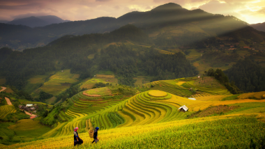 Terraced mountain field with two people in the foreground